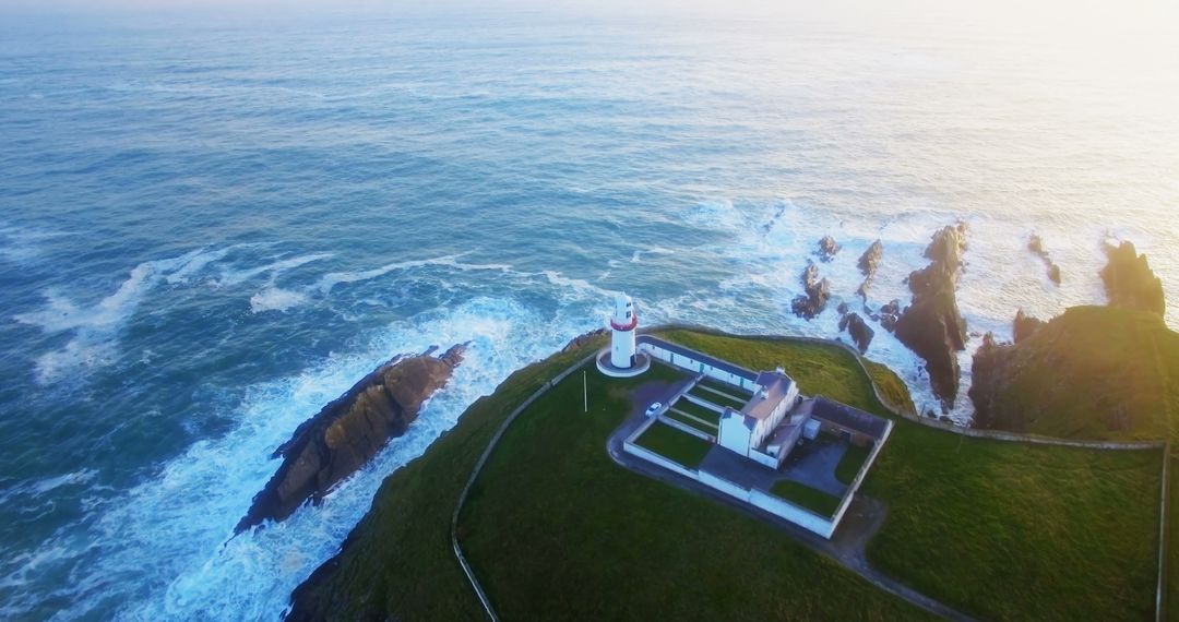 Aerial View of Lighthouse on Scenic Coastal Cliffs at Sunset - Free Images, Stock Photos and Pictures on Pikwizard.com