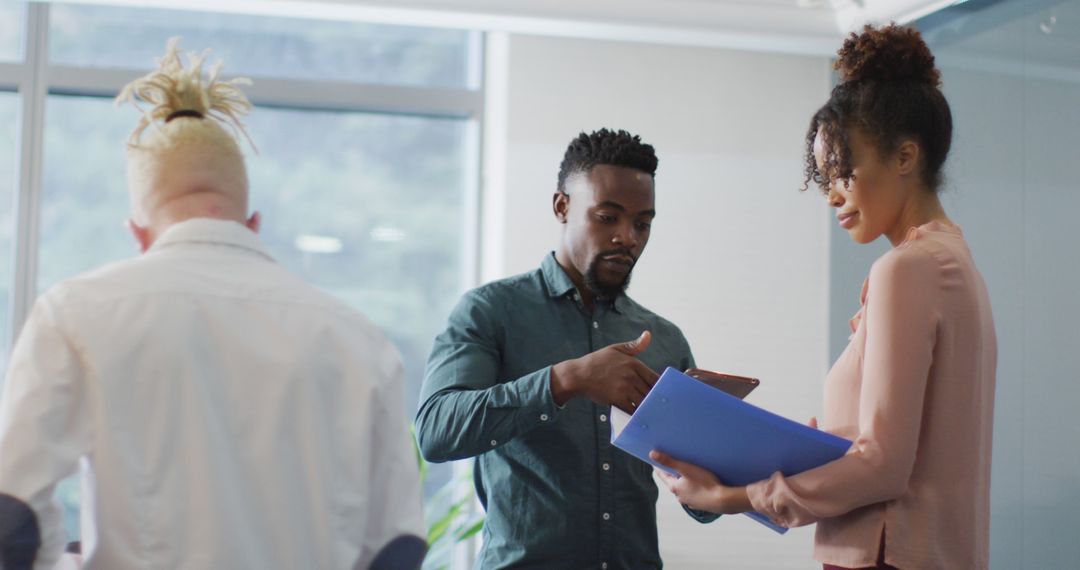 Diverse Businesspeople Collaborating in Modern Office Environment