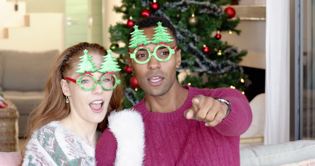 Couple Enjoying Christmas Celebration with Festive Tree Glasses