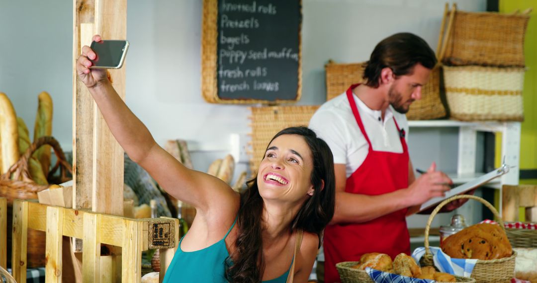 Smiling Woman Takes Selfie at Artisan Bakery - Free Images, Stock Photos and Pictures on Pikwizard.com