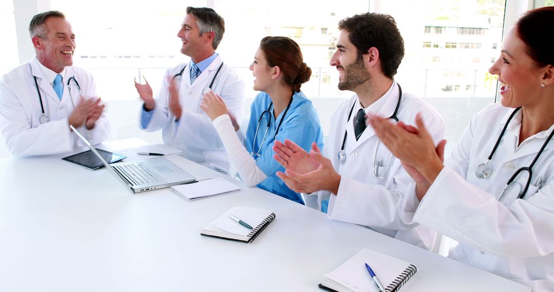 Medical Team Applauding After Successful Meeting - Free Images, Stock Photos and Pictures on Pikwizard.com