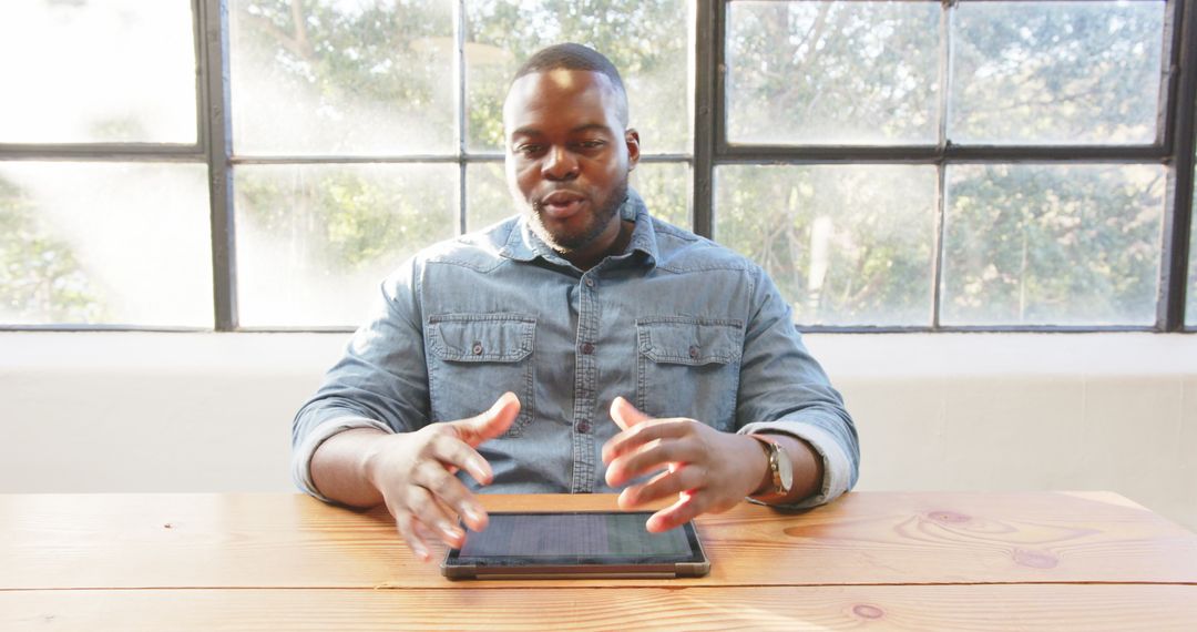 Confident Professional Using Tablet in Bright Office Space