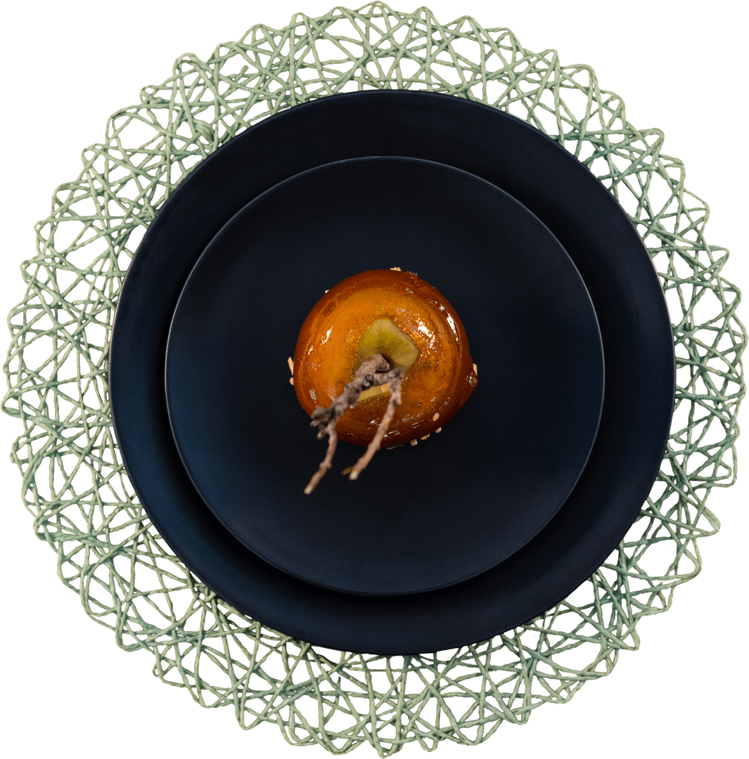 Elegant Transparent Display of Caramelized Apple on Black Plate