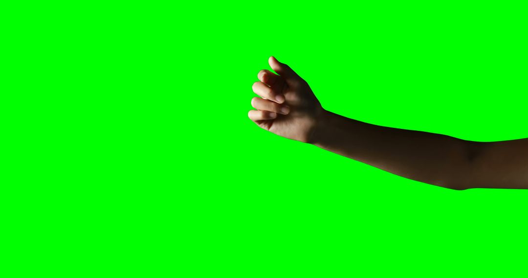 Isolated Woman’s Arm Showing Fist Gesture on Green Background - Free Images, Stock Photos and Pictures on Pikwizard.com