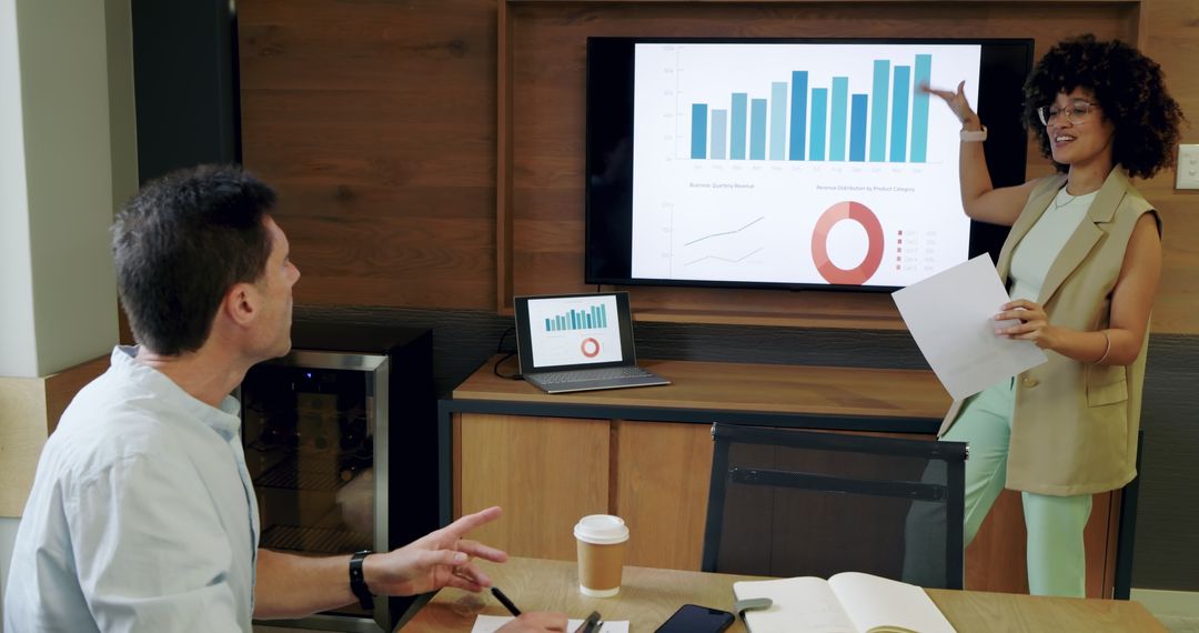 Colleagues Discussing Business Analytics in Modern Meeting Room