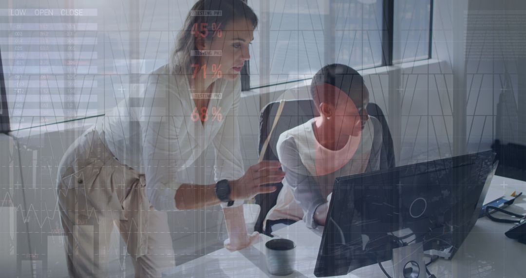Diverse Female Colleagues Analyzing Business Data on Computer