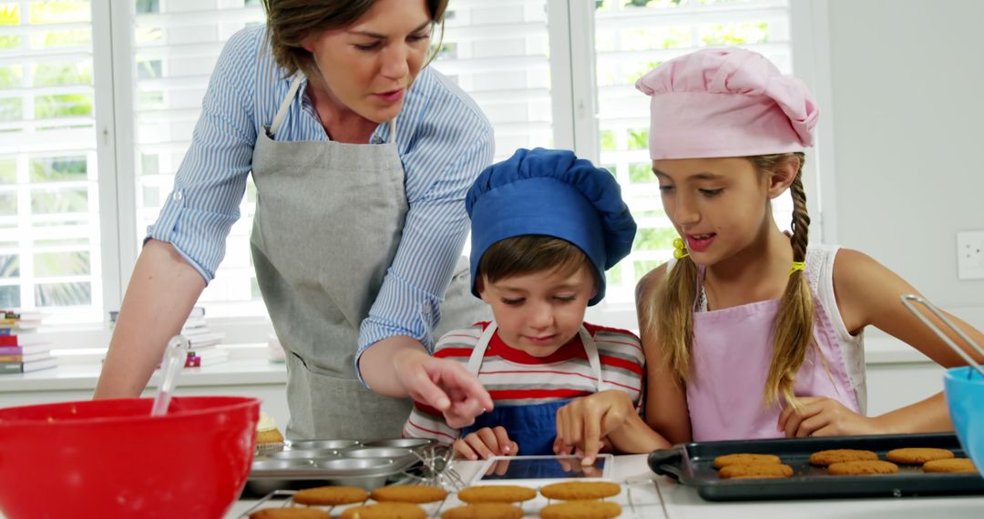 Mother Teaching Children Baking Lesson in Kitchen - Free Images, Stock Photos and Pictures on Pikwizard.com