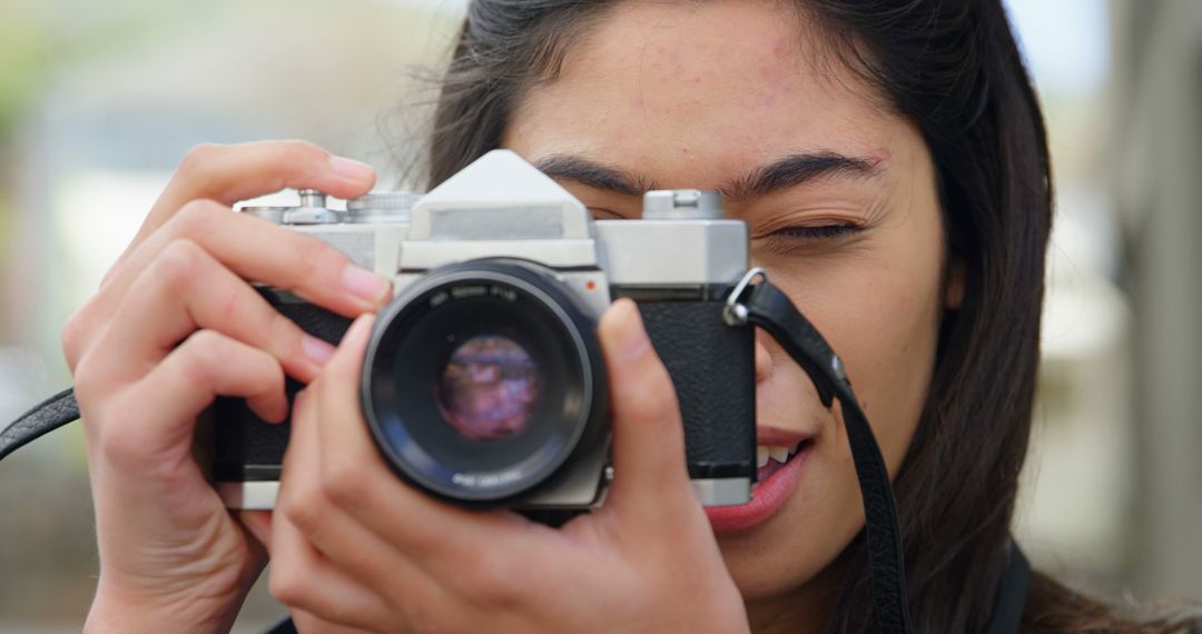 Woman Taking Photos with Vintage SLR Camera Outdoors - Free Images, Stock Photos and Pictures on Pikwizard.com