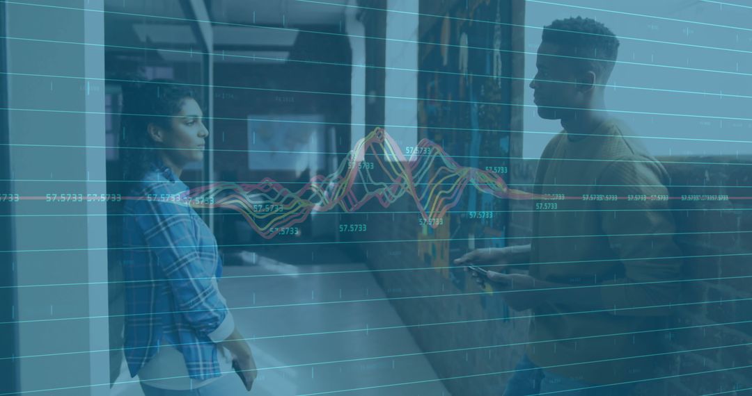 Colleagues Analyzing Financial Data with Overlay Charts
