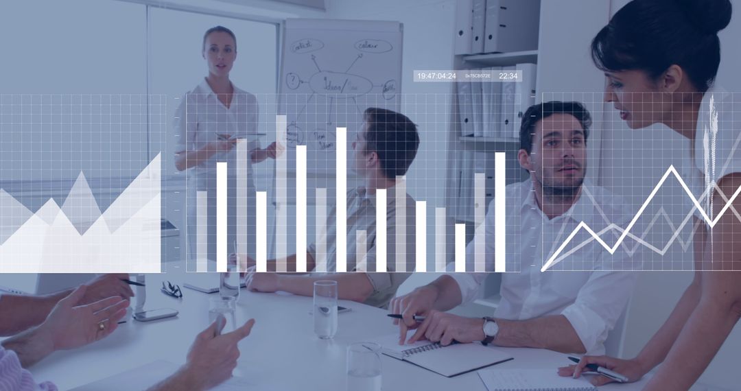Business Team Engaging in Data-Driven Meeting With Graph Overlays