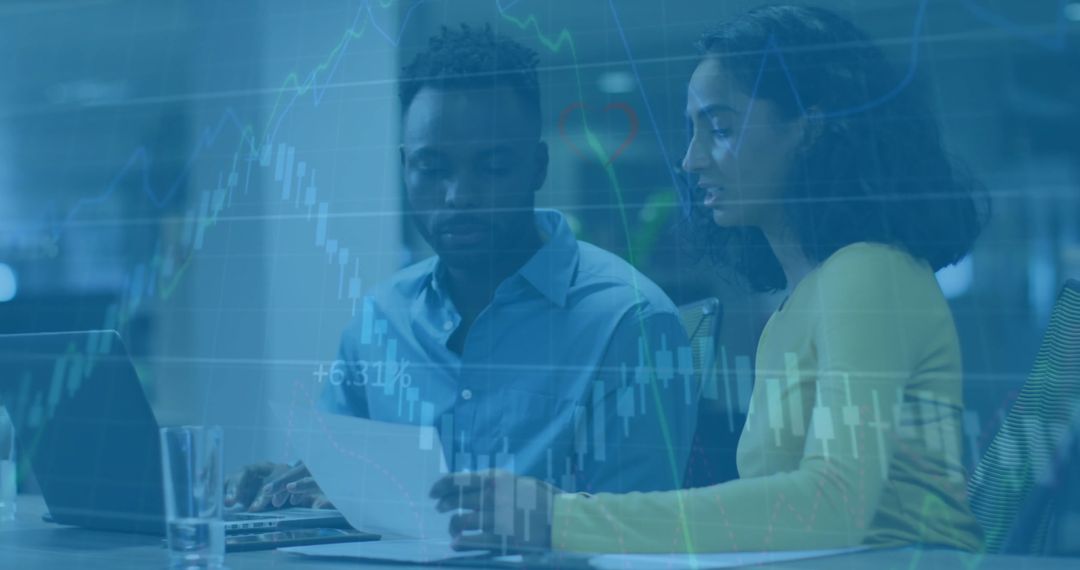 Diverse Colleagues Analyzing Financial Growth Data in Modern Office