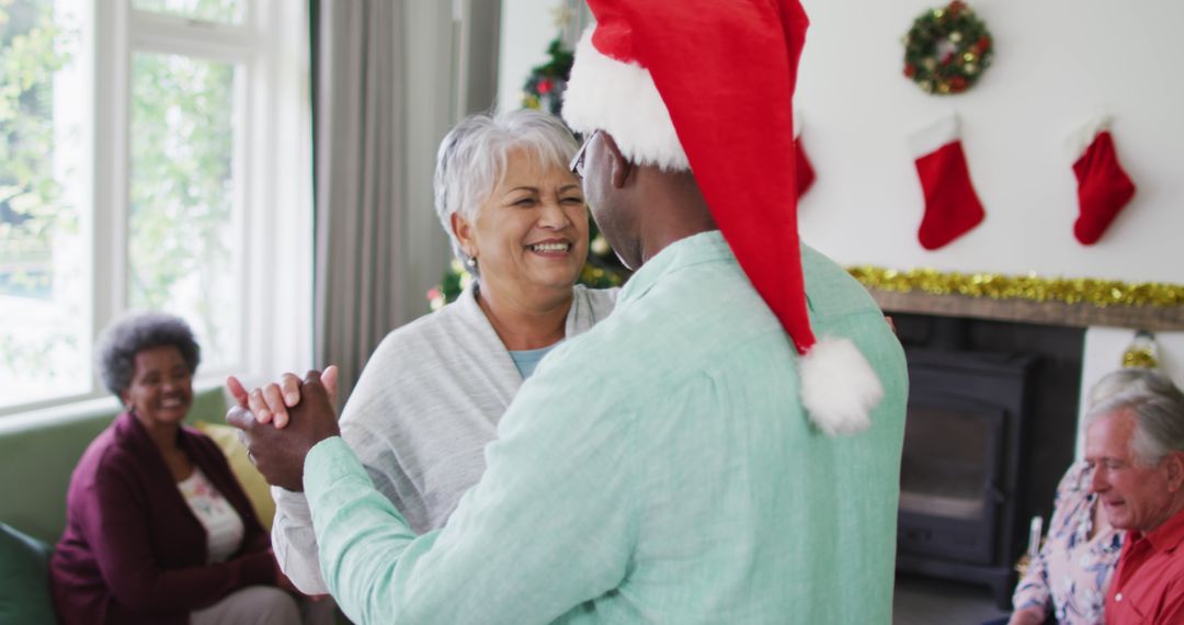 Happy Senior Couple Dancing During Christmas Celebration - Free Images, Stock Photos and Pictures on Pikwizard.com