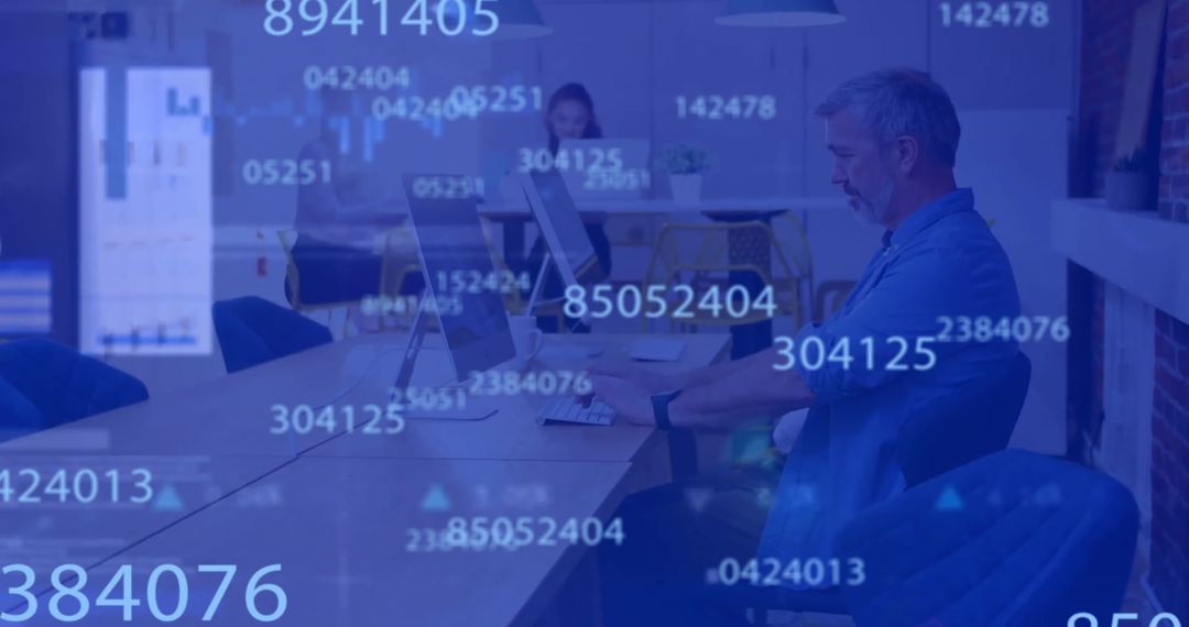 Senior Man Analyzing Digital Data in Modern Office Environment