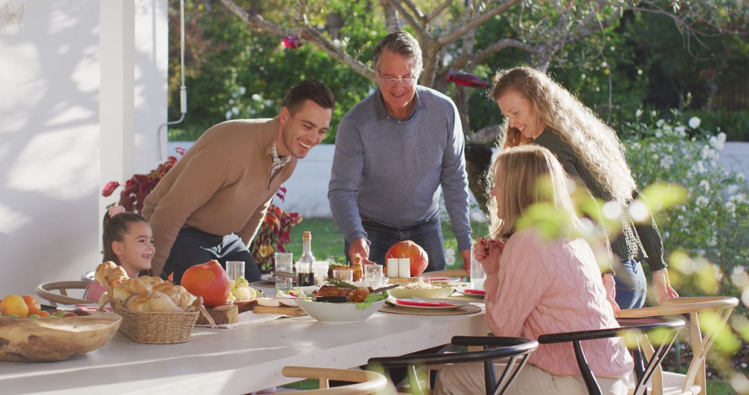 Happy Multigenerational Family Enjoying Outdoor Meal Together - Free Images, Stock Photos and Pictures on Pikwizard.com