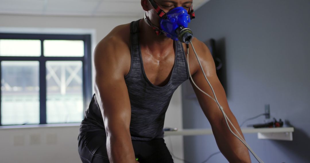 Athlete Training with Respiratory Mask in Fitness Lab - Free Images, Stock Photos and Pictures on Pikwizard.com