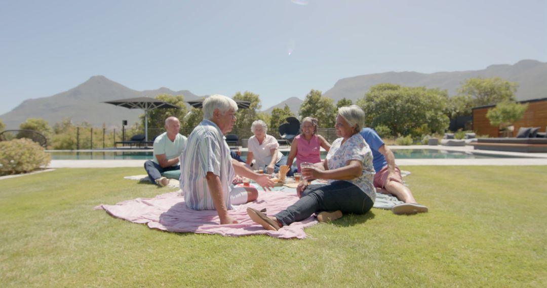 Senior Friends Enjoying Outdoor Picnic on a Sunny Day - Free Images, Stock Photos and Pictures on Pikwizard.com