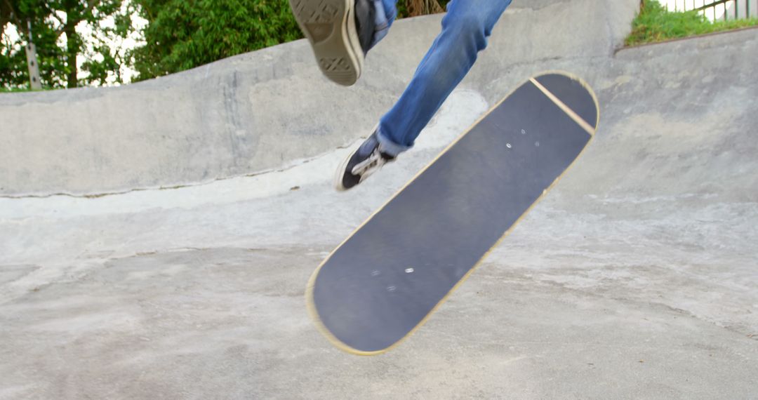 Skateboarder Performing Kickflip Trick at Skate Park - Free Images, Stock Photos and Pictures on Pikwizard.com