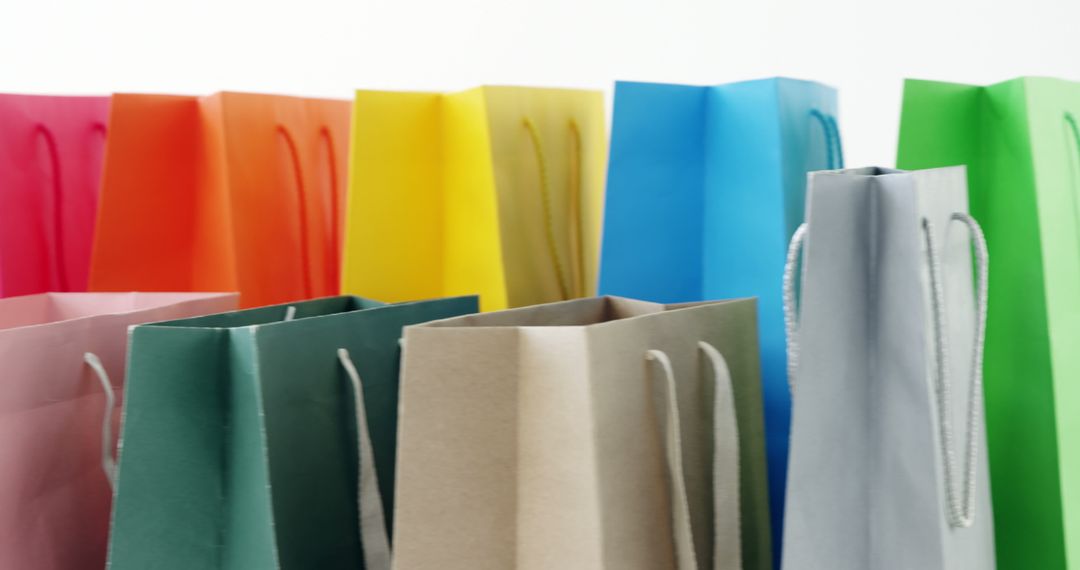 Colorful Shopping Bags Set Against White Background - Free Images, Stock Photos and Pictures on Pikwizard.com