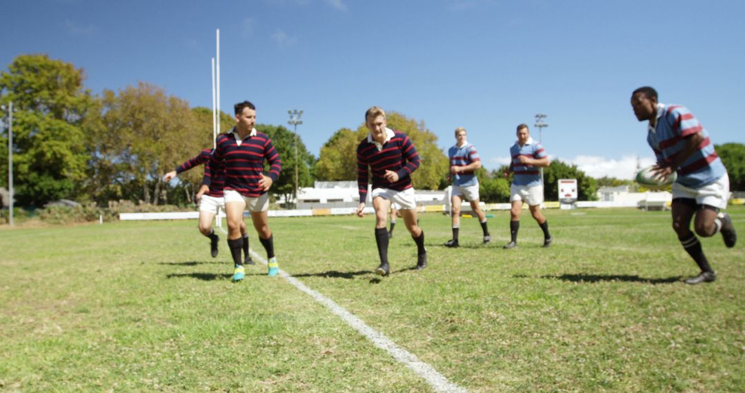 Rugby Team Running Together on Field During Practice - Free Images, Stock Photos and Pictures on Pikwizard.com