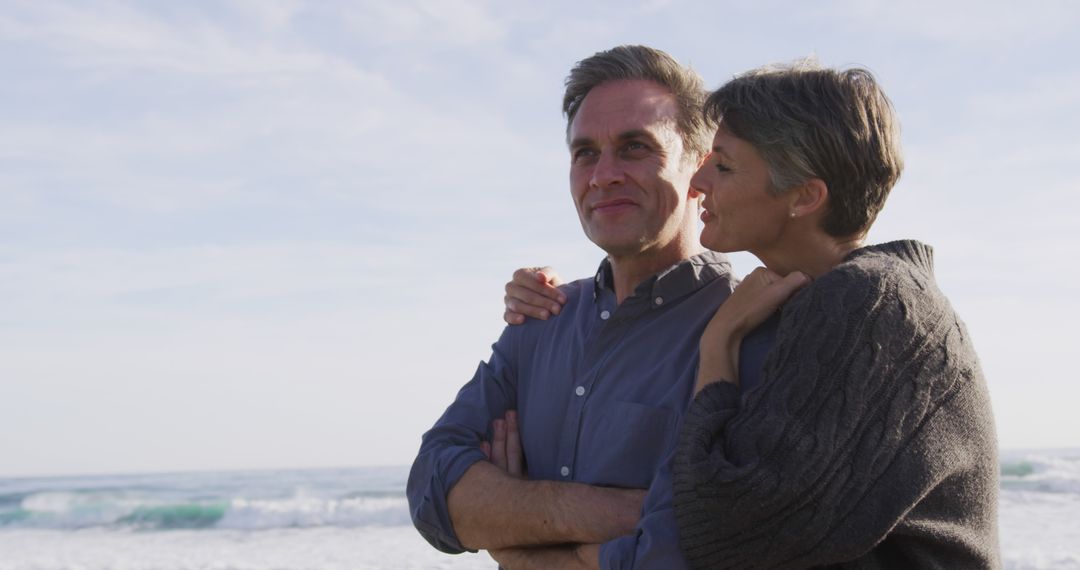 Happy Mature Couple Enjoying Beach Walk Together - Free Images, Stock Photos and Pictures on Pikwizard.com