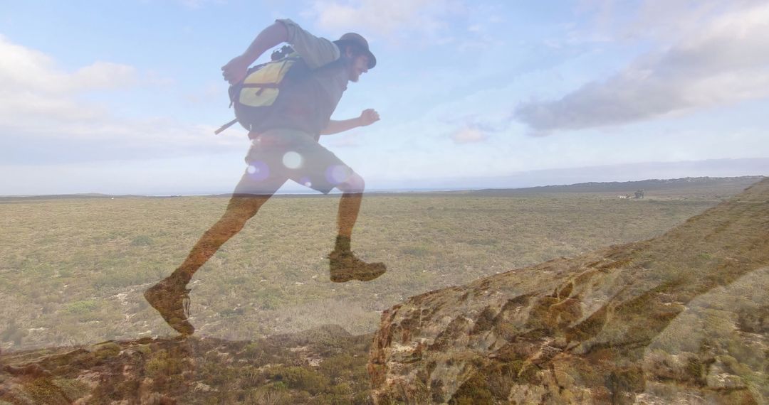 Hiker Jumping Over Rocky Terrain in Grassland Adventure