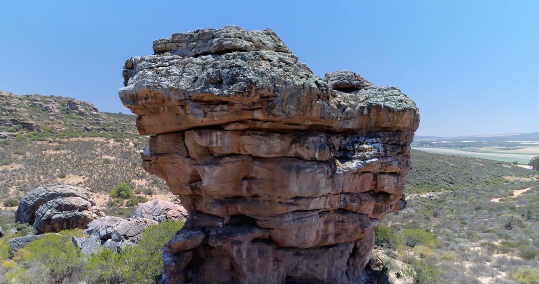 Majestic Rock Formation in Arid Landscape under Clear Blue Sky - Free Images, Stock Photos and Pictures on Pikwizard.com