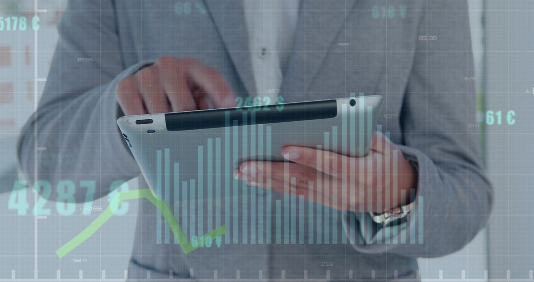 Businessman Analyzing Financial Data on Tablet Screen