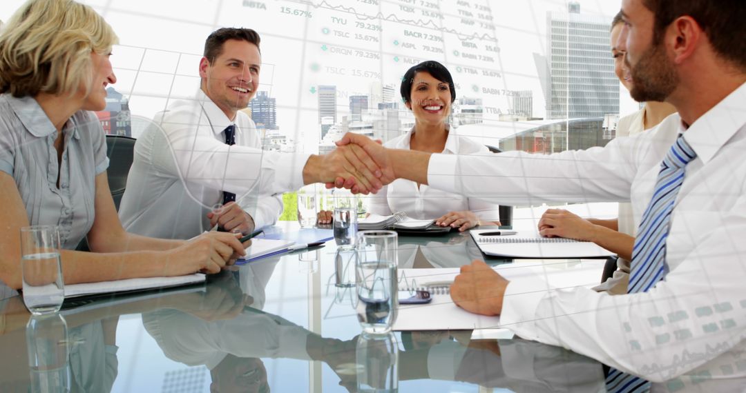 Diverse Colleagues Sealing Deal With Handshake in Modern Office
