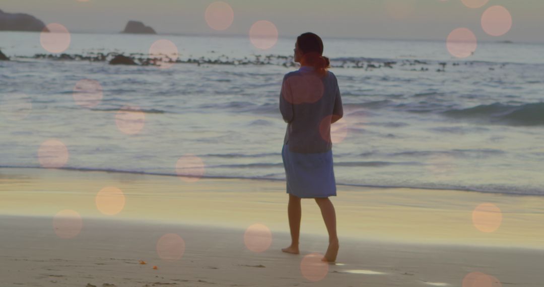 Serene Walk on Beach with Festive Lights