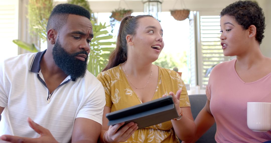 Diverse Friends Sharing Tablet and Discussing Technology Insights