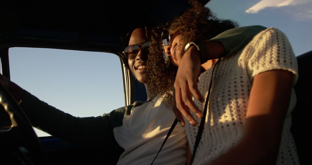 African American Couple Enjoying Road Trip in Sunlit Car - Free Images, Stock Photos and Pictures on Pikwizard.com