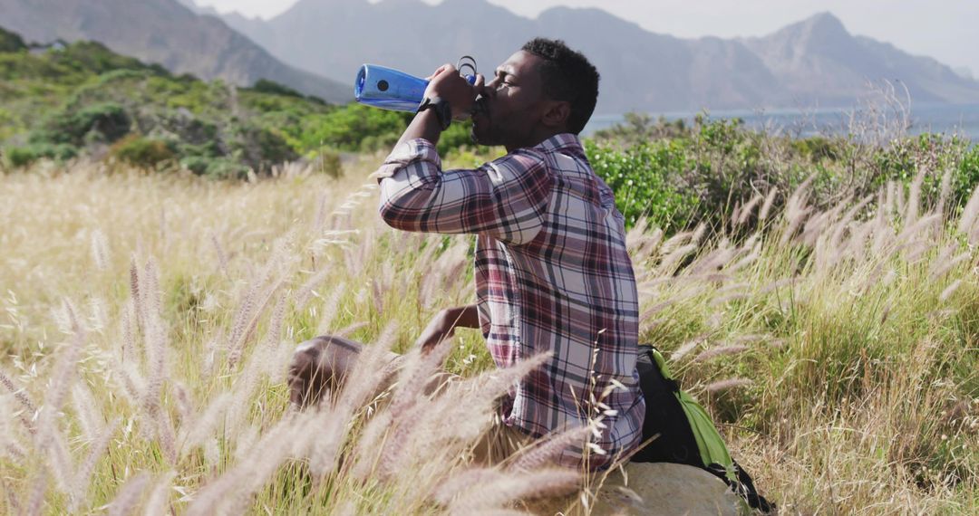 Adventurous Hiker Resting in Scenic Landscape Enjoying Nature