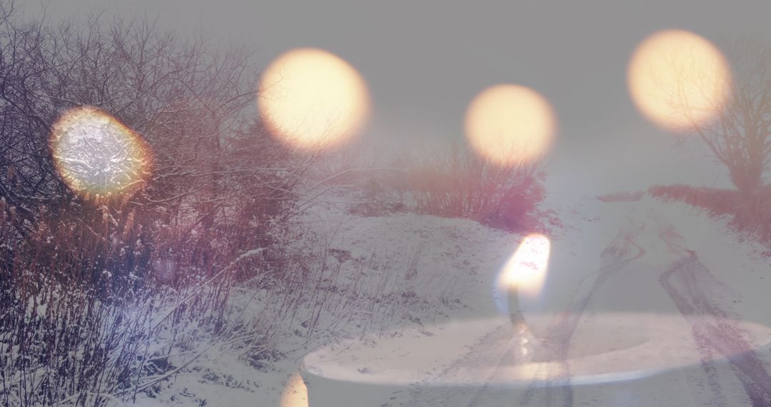 Candles Illuminating Snowy Road in Wintry Landscape