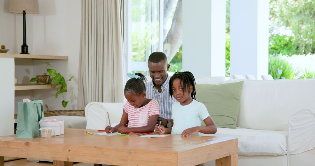 Children Engaging in Artistic Activity with Father at Home
