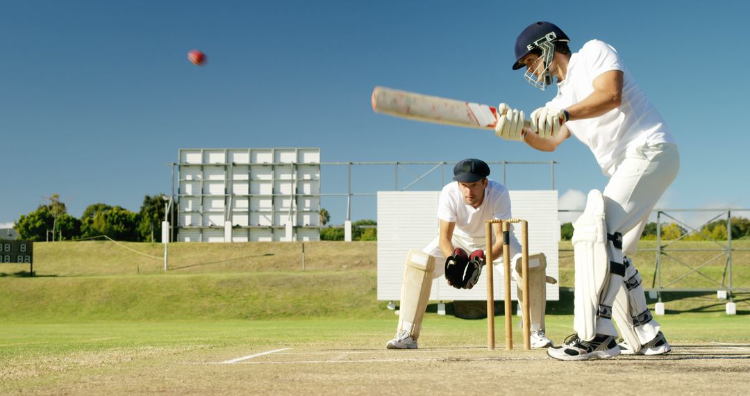 Cricket Batsman Hitting Ball During Sunny Day Match - Free Images, Stock Photos and Pictures on Pikwizard.com