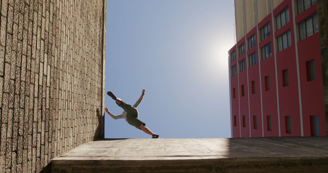 Parkour Athlete Jumping Between Buildings in Urban Landscape - Free Images, Stock Photos and Pictures on Pikwizard.com