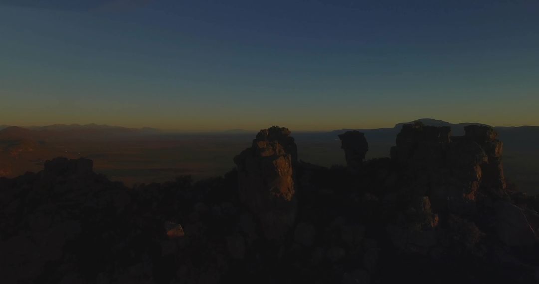 Dramatic Twilight View of Rock Pillars on Desert Plateau