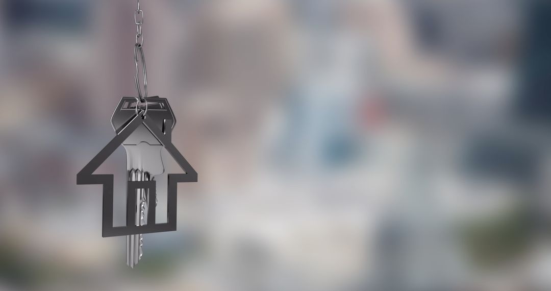 House-Shaped Keychain with Keys Over Blurred City