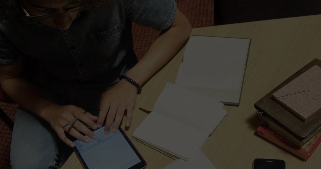 Technology and Learning in Workspace with Denim Shirt Man