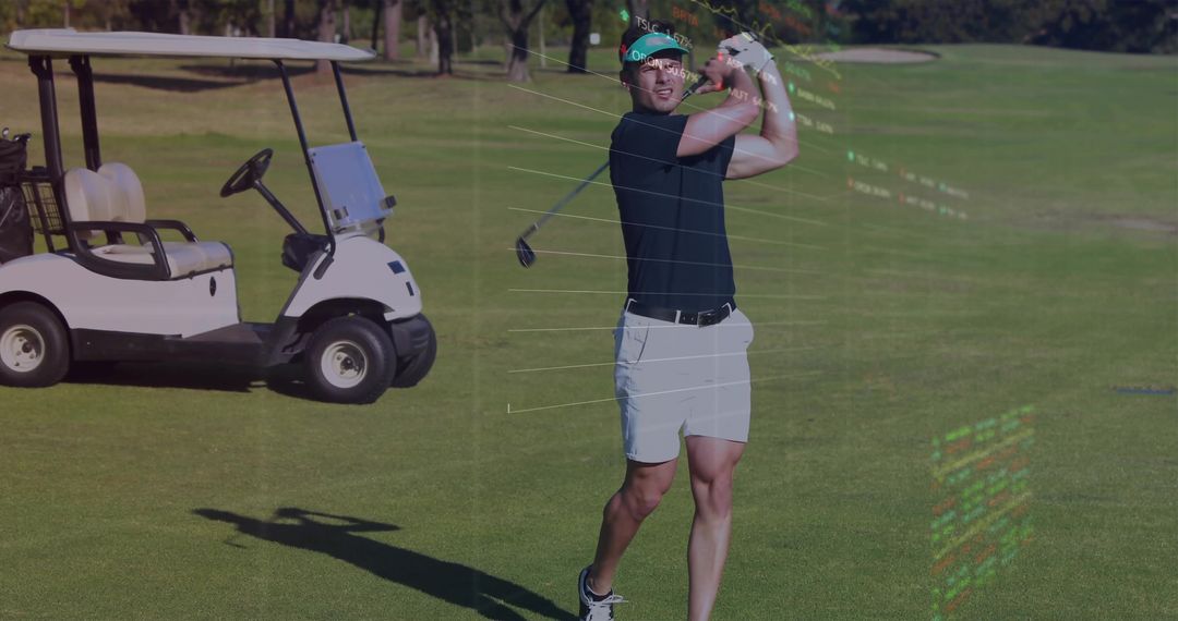 Athletic golfer following through on fairway with golf cart and motion analysis overlay