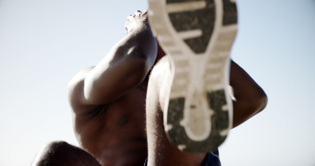 Man Engaging in Outdoor Fitness Routine Radiates Determination