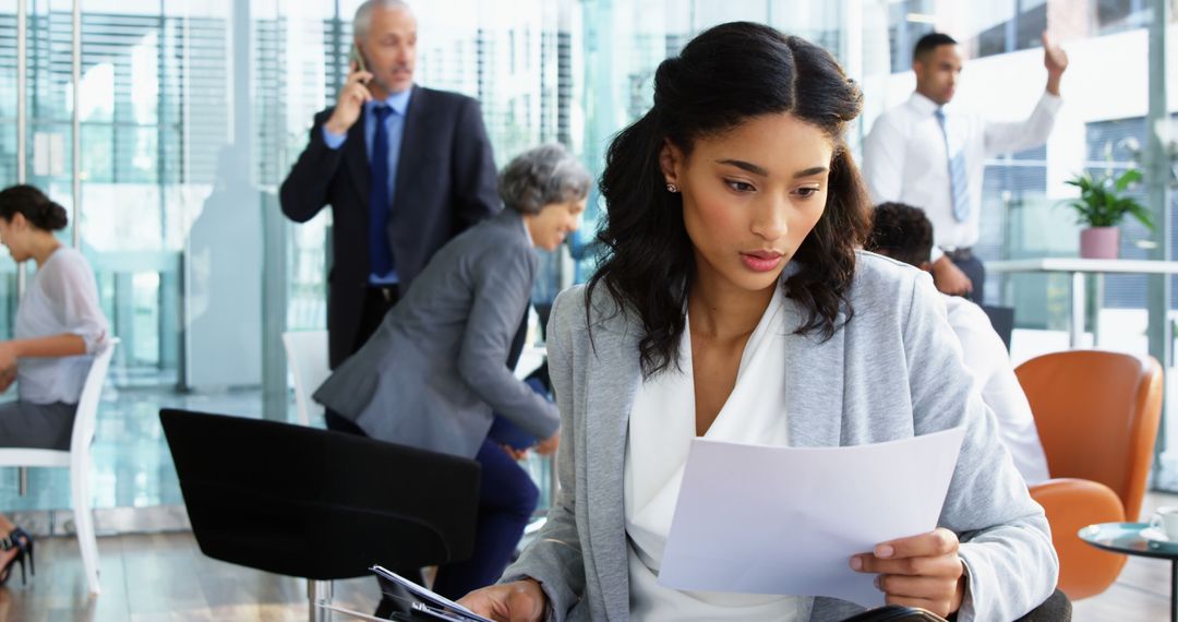 Focused Businesswoman Analyzing Document in Office Environment