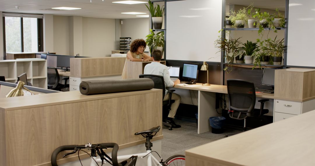 Diverse Team Collaborating in Modern Workspace with Greenery