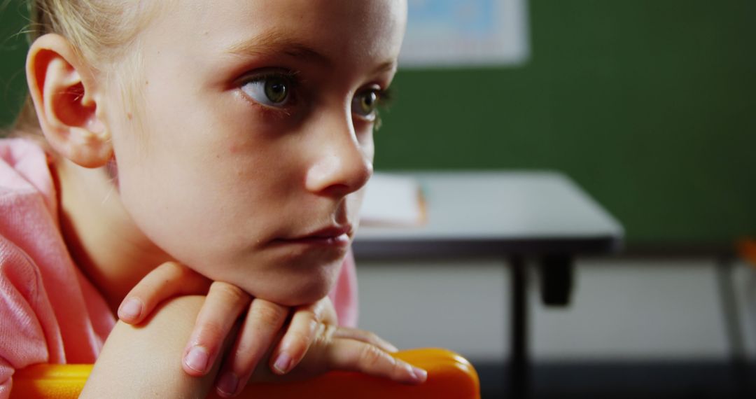 Thoughtful Girl in Classroom Looking Pensive - Free Images, Stock Photos and Pictures on Pikwizard.com