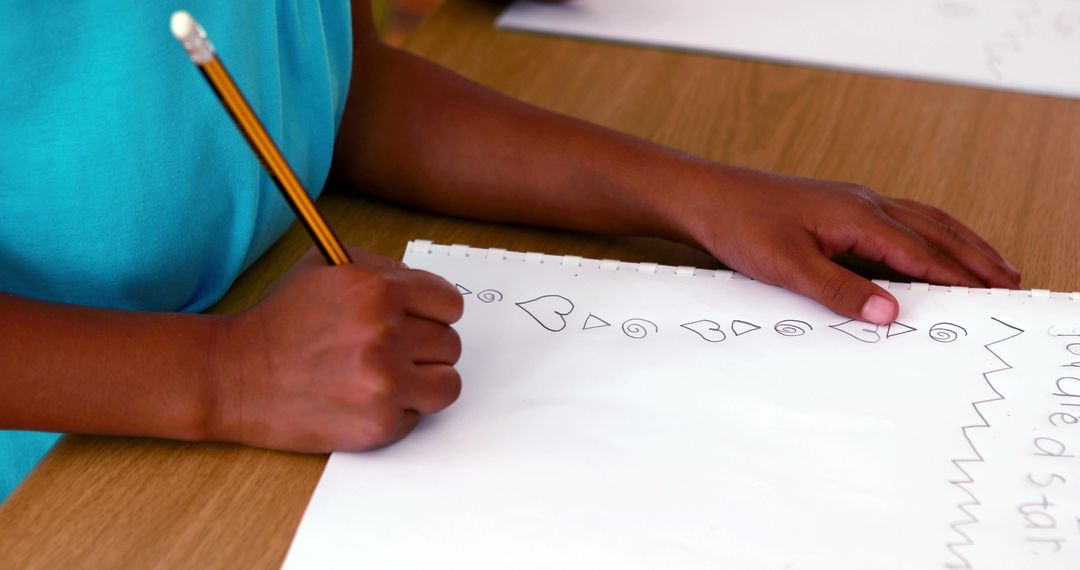 Child Drawing Shapes on Paper with Pencil - Free Images, Stock Photos and Pictures on Pikwizard.com