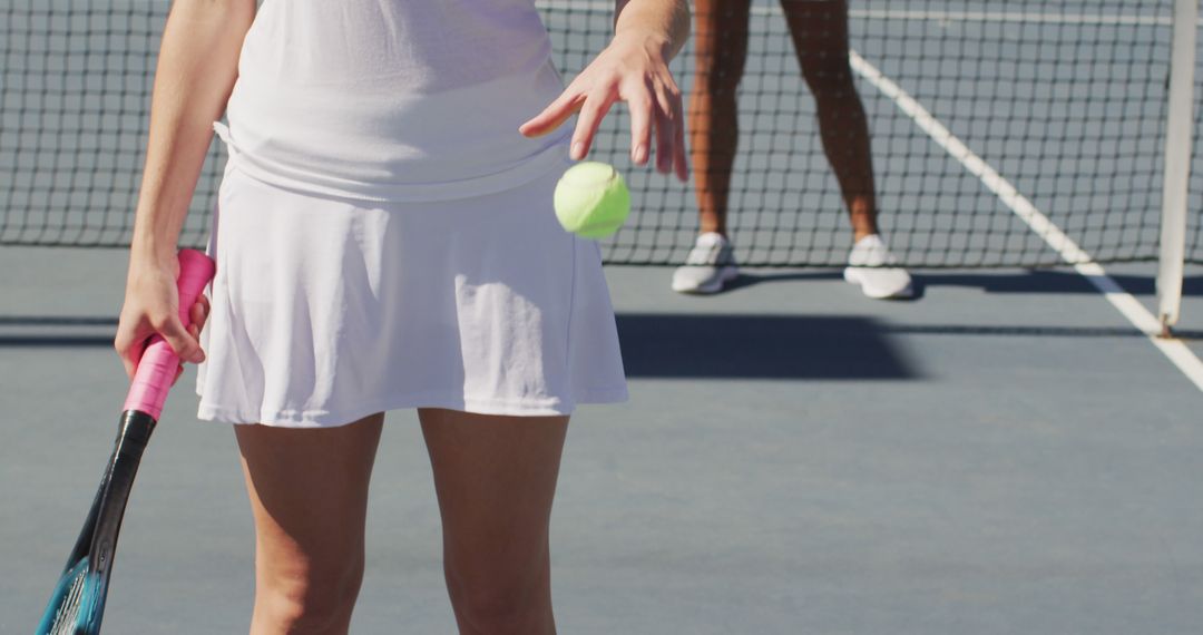 Focused Woman Preparing to Serve on Tennis Court - Free Images, Stock Photos and Pictures on Pikwizard.com