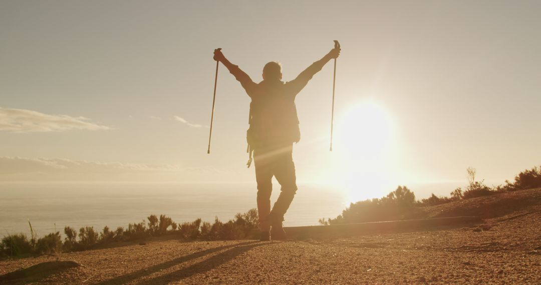 Hiker Celebrating at Sunrise on Mountain Trail - Free Images, Stock Photos and Pictures on Pikwizard.com