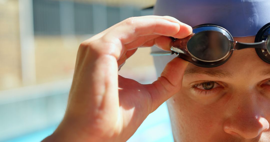 Close-up of Swimmer Adjusting Goggles by Pool - Free Images, Stock Photos and Pictures on Pikwizard.com