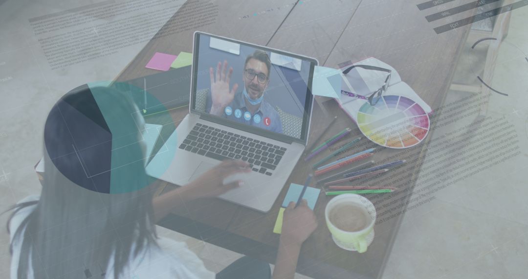 Designer Engaging in Video Call with Overlaid Financial Graphs
