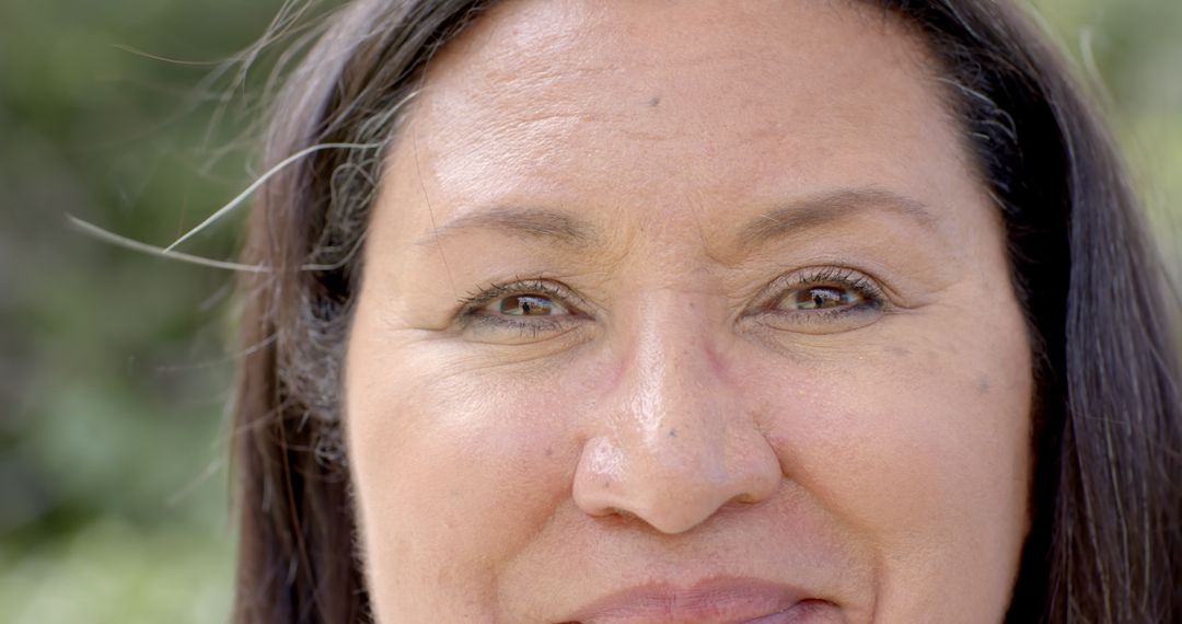 Senior Woman Smiling in Garen with Natural Setting